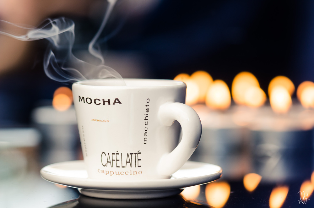 Okay, that is SOOO enticing!!! But don't be fooled, that is only a candle in the cup. I snuffed it out to get the "steam". I used a mirror, glass-topped coffee table, and cloth for the background,&nbsp;tea-lights to add a romantic feeling, and my flash for the soft-even light.&nbsp;